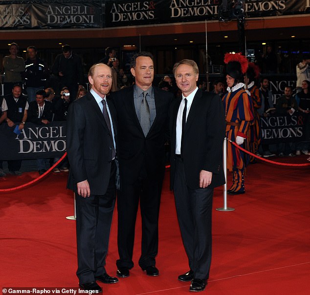 Director Ron Howard, actor Tom Hanks and author Dan Brown at the world premiere of the film Angels & Demons in Rome in 2009.