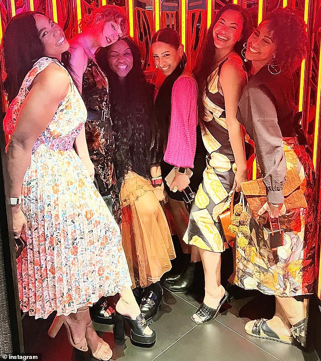 Another image in Jeslyn's album showed Taylor wearing a sparkly leaf-print dress as she and a claque of her backup singers enjoyed a night out at an unspecified location.