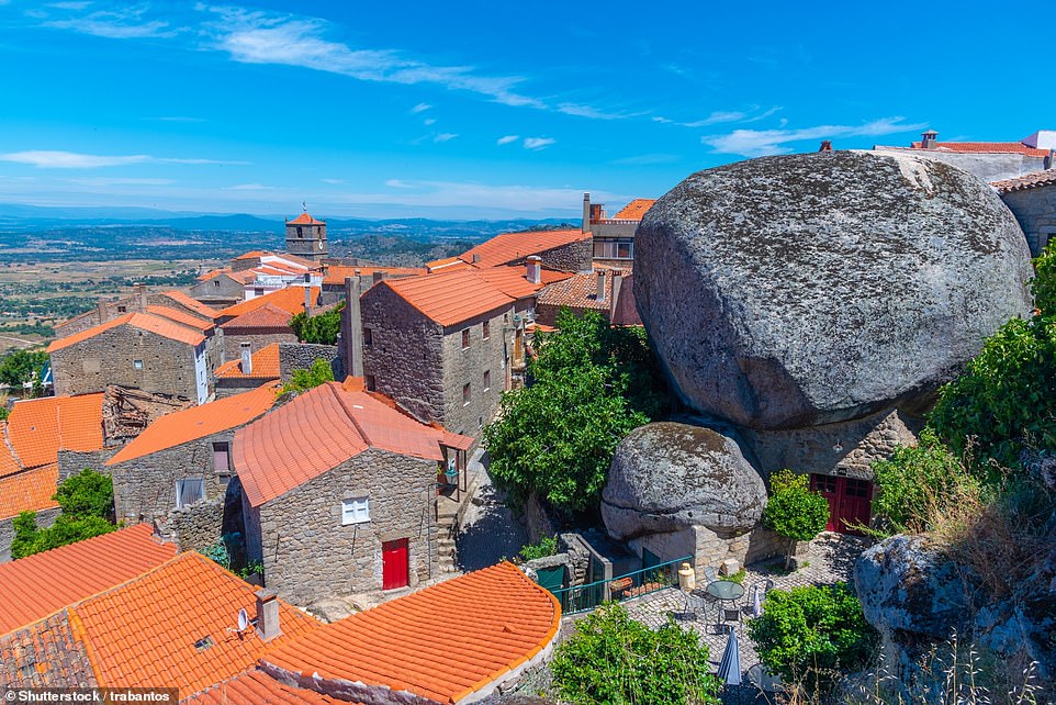 MONSANTO, EASTERN PORTUGAL: In this mountaintop town, residents have built their homes in and around huge rocks. Elaine Warren, travel expert at The Family Cruise Companion, says: 