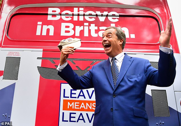 Nigel Farage, leader of the Reform Party and deputy chairman of Leave Means Leave, celebrates outside a campaign bus in Westminster on December 24, 2020.