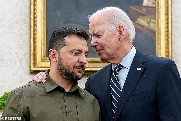 Ukrainian President Volodymyr Zelenskiy is hugged by US President Joe Biden in the Oval Office of the White House in Washington, September 21, 2023.