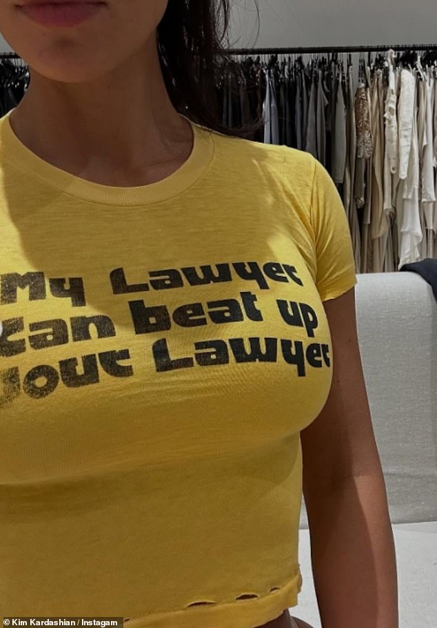 In another image, Kim wore a cropped yellow T-shirt with the message 