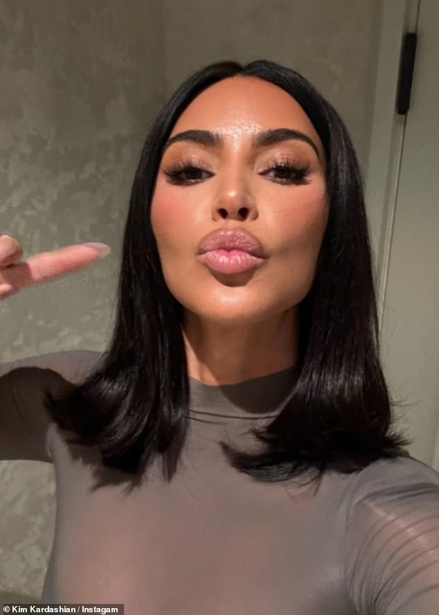 Kim pouted for a selfie while sporting a glamorous makeup palette and shoulder-length hairstyle.