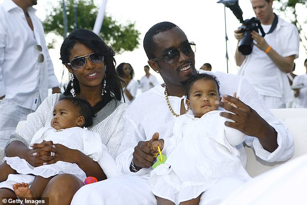 Diddy photographed with his partner Kim Porter and their twin daughters D'Lila and Jessie in 2007.