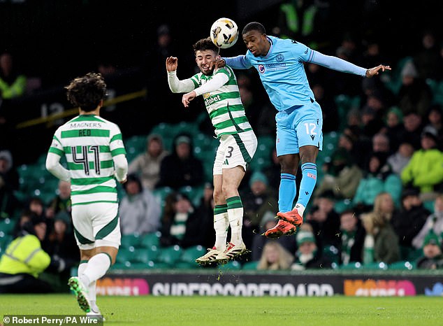 Taylor looks for a header with Roland Idowu during the St Mirren match