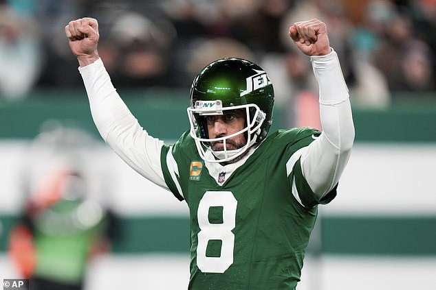 Rodgers threw four touchdowns and the Jets ended a dismal season with a win against Miami.