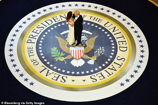 First lady Melania Trump (left) dances with President Donald Trump (right) during A Salute To Our Armed Services Inaugural Ball on January 20, 2017 - one of three official balls scheduled for inauguration night that the president and first lady attended