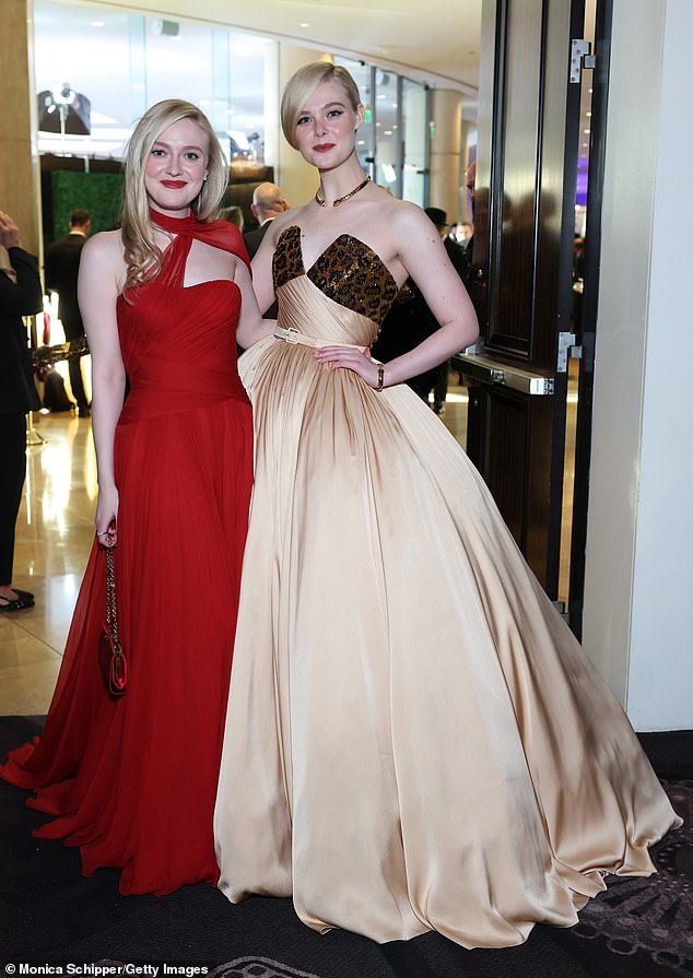 Hours earlier, Fanning looked glamorous in a red Dolce & Gabbana dress while her younger sister sported a custom recreation of a Pierre Balmain FW/53 couture ballgown, both curated by stylist Samantha McMillen.