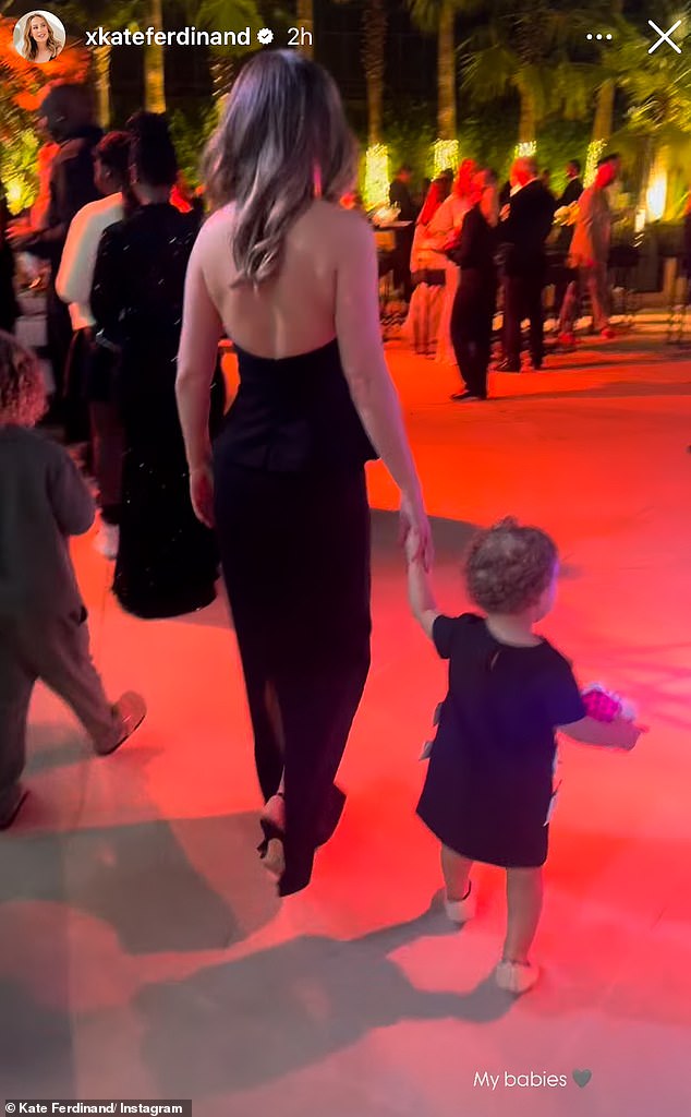 An adorable video showed Kate, looking sensational in a black halterneck and skirt ensemble, holding hands with her son Cree and daughter Shae.