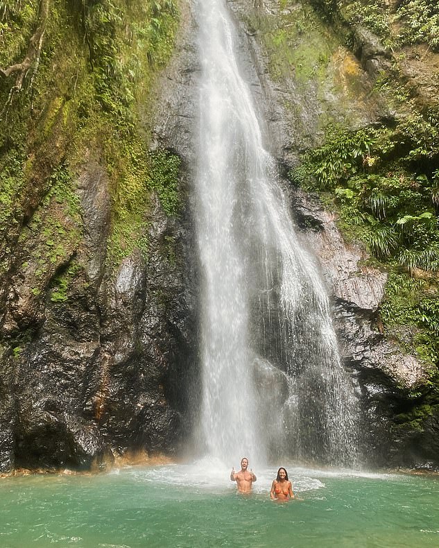 The DJ, 40, posted a rare joint photo of the pair bathing in the turquoise waters below Syndicate Falls on the Caribbean island of Dominica.