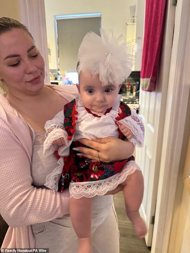 Six-month-old Sophia Kelemen in her mother's arms. The baby was airlifted to hospital with a broken pelvis and a brain bleed and was eventually diagnosed with brain damage from the impact.