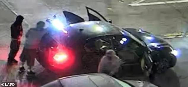 Los Angeles police previously released two images of the suspects and their getaway car (pictured above) as they appealed to the public for help identifying them