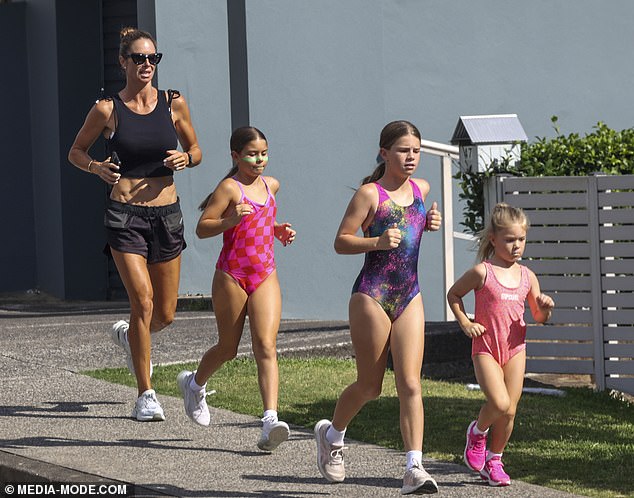 The former iron woman was seen enjoying some quality time with her three daughters while they went to a family business in Maroubra.