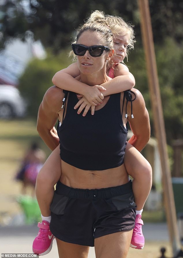 At one point, Candice was seen carrying her youngest daughter, Isla, on her back after the grueling workout session.