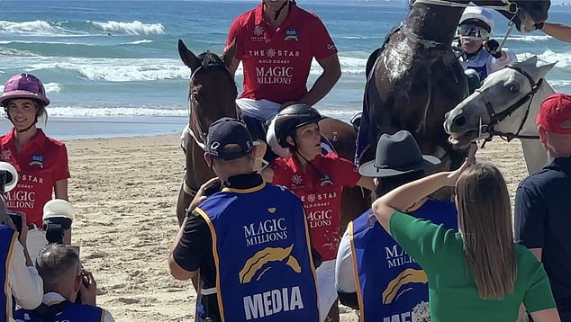 In the video, Zara can be seen smiling and holding the reins of two horses just before the third horse rears, lurches forward and lands on her shoulder.