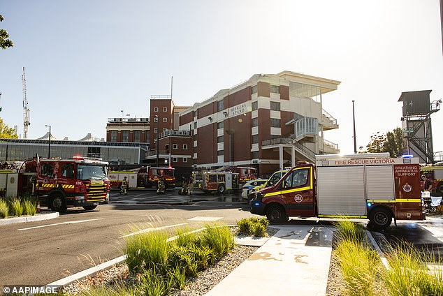 Police have obtained copies of CCTV footage which is expected to play an important role in the ongoing investigations into the cause of the fire (pictured, emergency services at the scene)