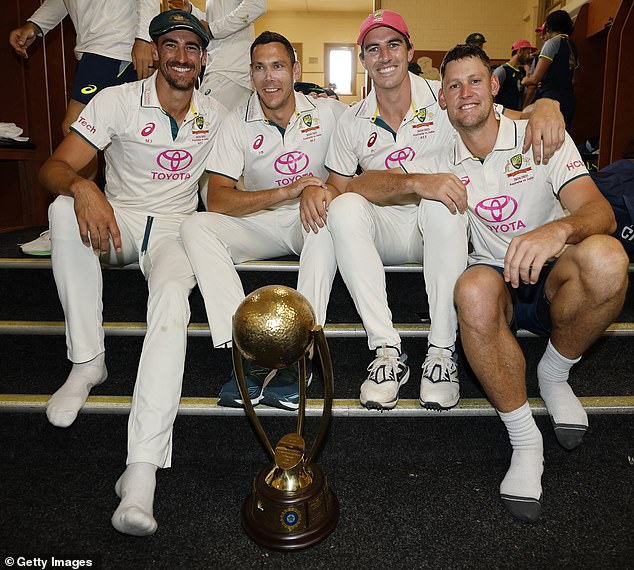 Mitchell Starc, Scott Boland, Pat Cummins and Beau Webster (right) after Australia defeated India at the SCG