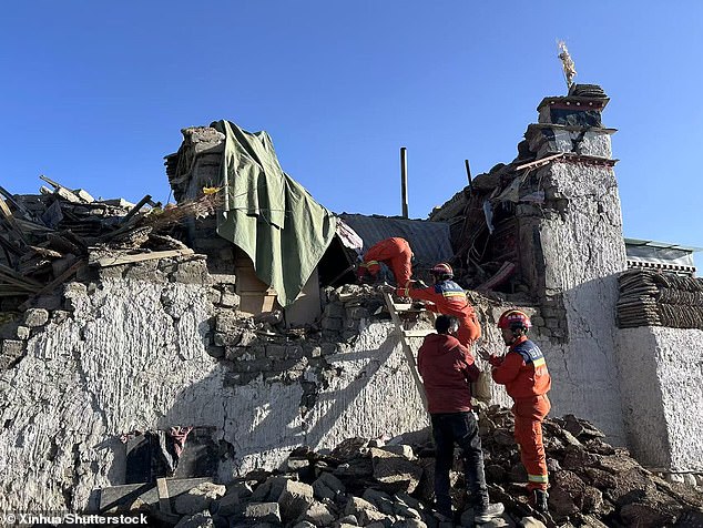 Rescue workers work in an earthquake-hit area in Dingri's Changsuo township of Xigaze, southwest China