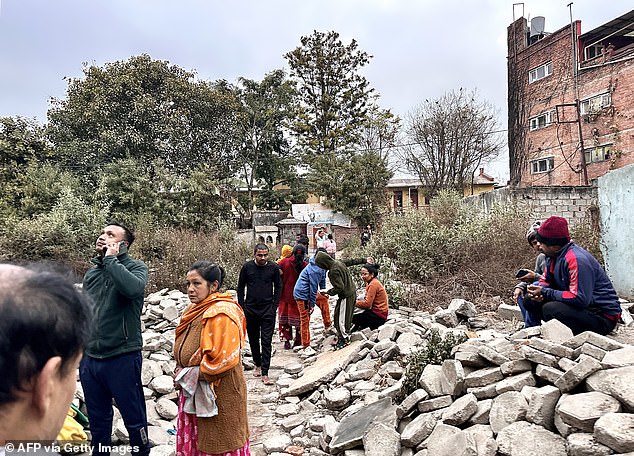 People gather in an open space after the Kathmandu earthquakes, in the early hours of January 7, 2025