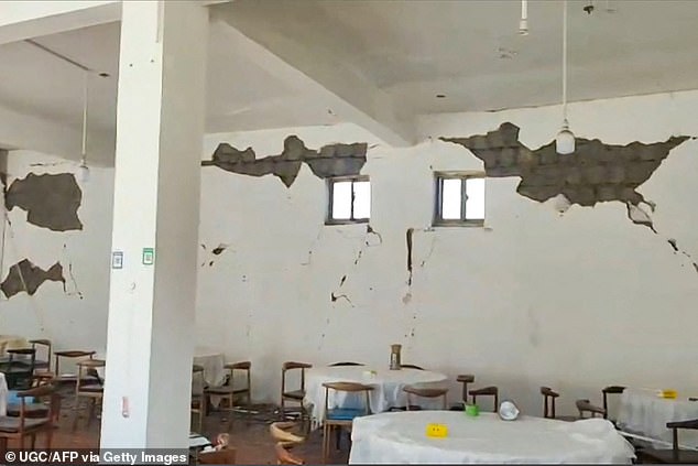 This frame shot from a January 7, 2025 user-generated content (UGC) video shows cracks in the walls of a restaurant in Lhatse County, Tibet, China