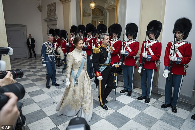 Mary was photographed smiling sweetly as she stepped out in the stunning dress, polishing off the ensemble with a pair of crisp white gloves and a baby blue sash across her chest.