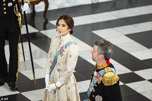 The royal wore her thick chocolate tresses in an elegant updo with her sleek bangs framing her face.