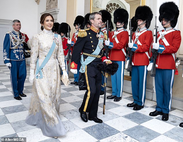 Meanwhile, Frederik looks dapper in full military attire, sporting a full black suit, gold epaulets, and a sky blue sash the same shade as the one his wife wears.