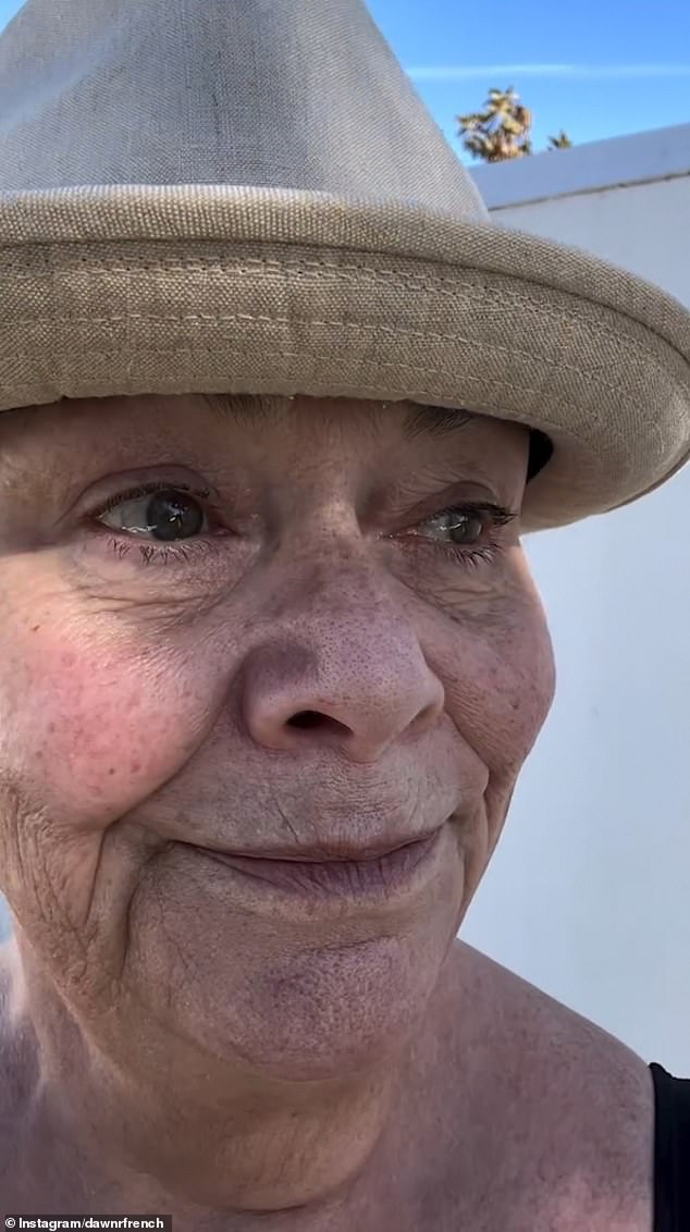 Shielding herself from the sun with a straw hat, Dawn looked happy and relaxed after escaping the cool January weather to soak up the winter sun.