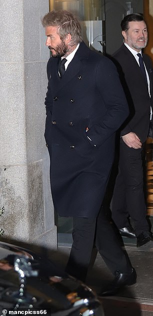 David wrapped up in a stylish navy winter coat after spending the day in Manchester to attend the funeral of beloved former Manchester United receptionist Kath Phipps.