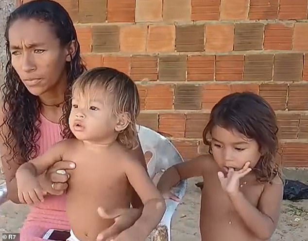 Francisca da Silva with her one-year-old son Igno and three-year-old daughter Maria Lauane