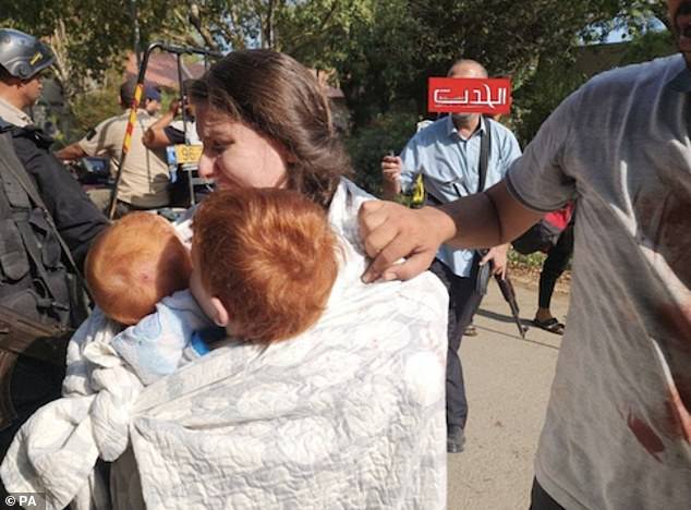 The image of the two children being carried by their crying mother, Shiri, as they were taken from their homes was one of the most shocking published in the early days of the war between Israel and Hamas.