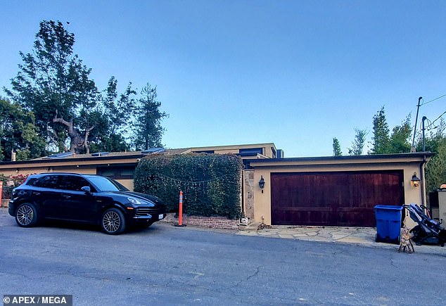 Spencer was seen in photos and videos watching the rapidly advancing wildfire near the home he and Heidi share with their two young children; His house appears in the photo before the fire reached it.