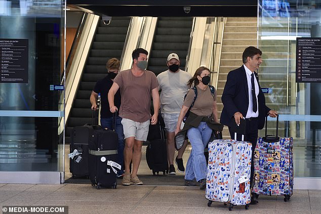 The mother-of-two's luggage was adorned with Disney characters like Mickey Mouse, making it stand out from travelers' plain-colored bags.