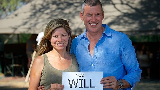 The couple are seen holding a sign remembering their friend Will Poovey, who died in a train accident shortly before the wedding.