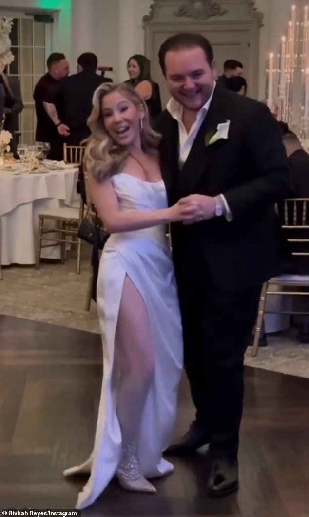 Caitlin stunned in a strapless satin dress that featured a daring thigh-high slit that revealed a pair of dazzling white thigh-high boots as she danced with her stylish new husband.