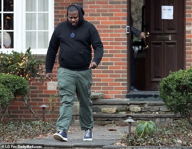 A private security guard leaves the Fauci residence after an outing