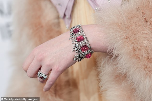 As for jewelry, Elle upped the glamor with a Resonances de Cartier bracelet and a fierce Panthère de Cartier ring.