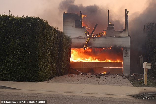 The windows were smashed and black smoke came from the house