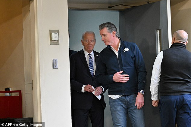 President Joe Biden (left) arrives for a wildfire briefing at a Santa Monica fire station with California Governor Gavin Newsom (right) on Wednesday after meeting his great-grandchild at Cedars Sinai Hospital in Los Angeles