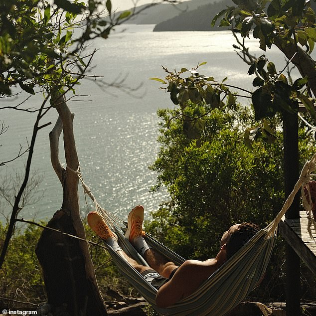 The Panthers running back even managed to enjoy some downtime in a hammock on Hayman Island (pictured).