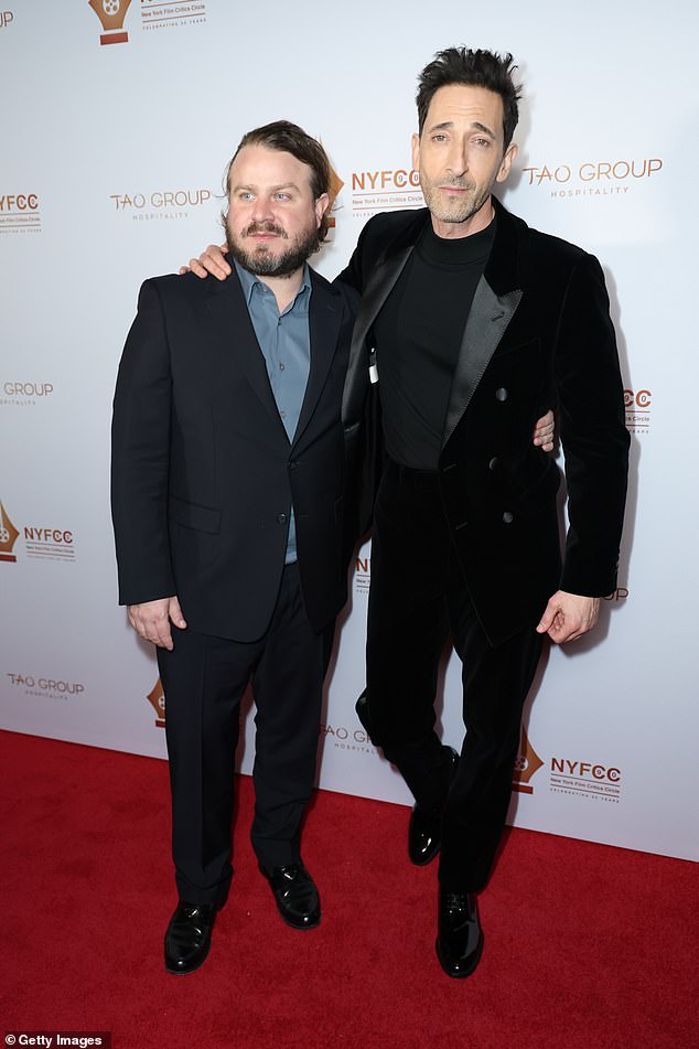 Brody also posed alongside director Brady Corbet, 36, who cut a handsome figure in a black suit.