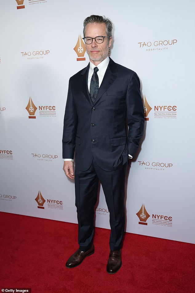 Guy Pearce, 57, looked more handsome than ever in a dark suit and black tie.