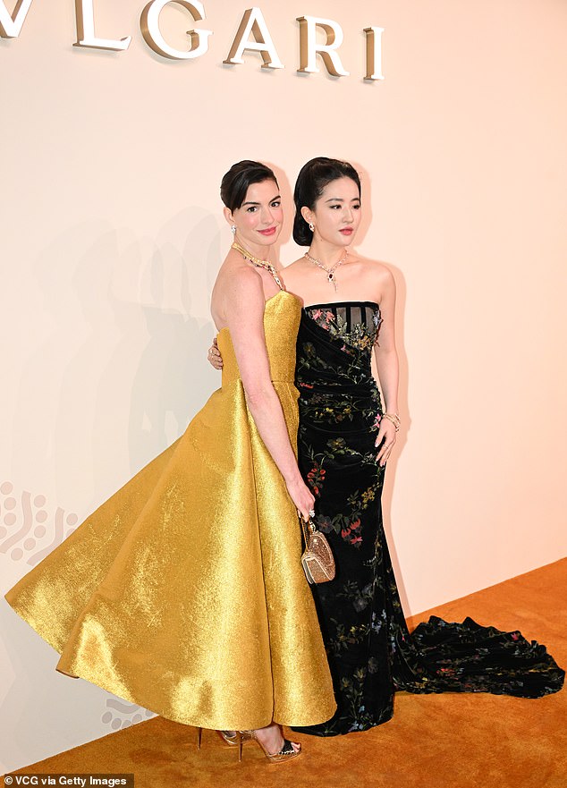 Anne, holding a heart-shaped clutch, is a global brand ambassador for the Italian luxury fashion house, as is The Tale of Rose actress Yifei Liu (right).