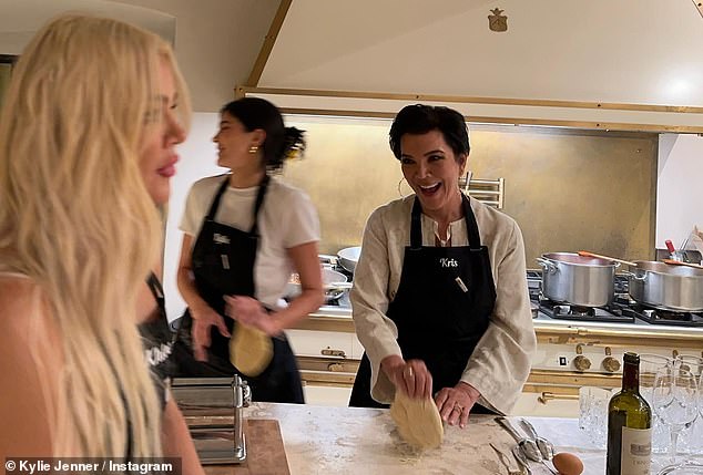 The makeup mogul was spotted making pasta dough with Kris and Khloe in a large kitchen with a half-full bottle of red wine open