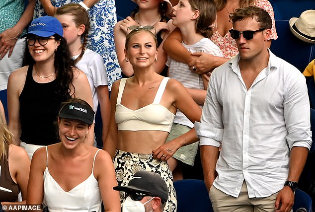 The couple, both fitness fanatics, met through the running and cycling app Strava and began dating in 2020. They appear here at the Australian Open at Melbourne Park in early 2022.