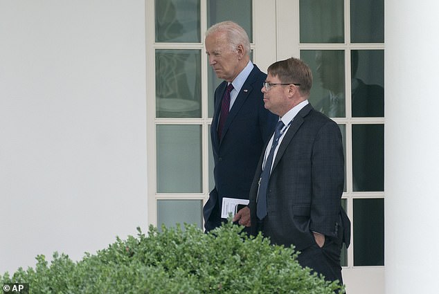 President Joe Biden walks past the White House Colonnade with his doctor Kevin O'Connor, Monday, August 28, 2023