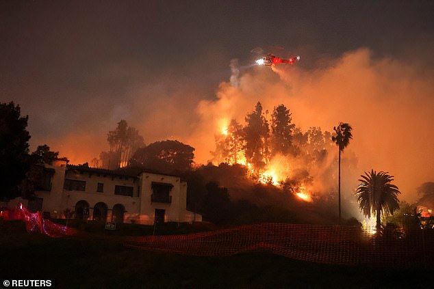 Flames rise from the Sunset Fire in the hills overlooking the Hollywood district of Los Angeles