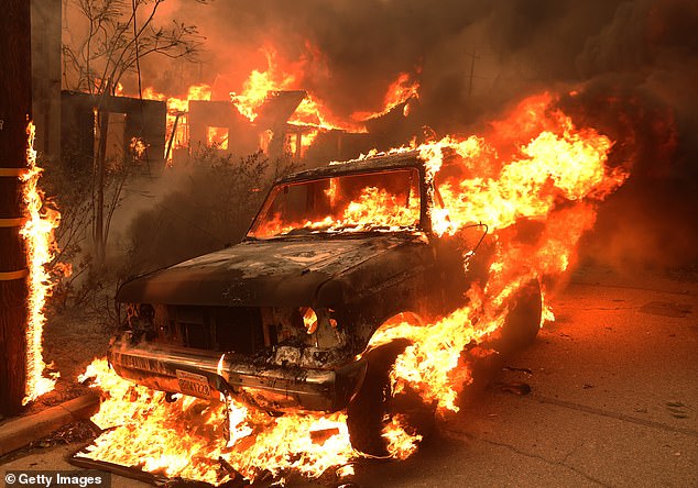 A car burns as the Eaton Fire swept through the Altadena area of ​​California yesterday