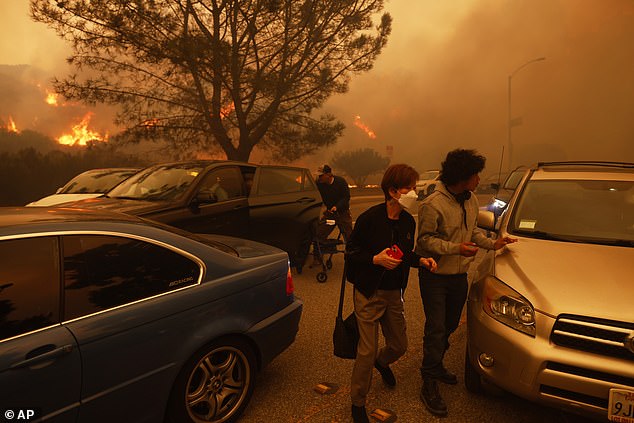 Yesterday people fled by car and on foot from the advance of the Palisades fire in Los Angeles.