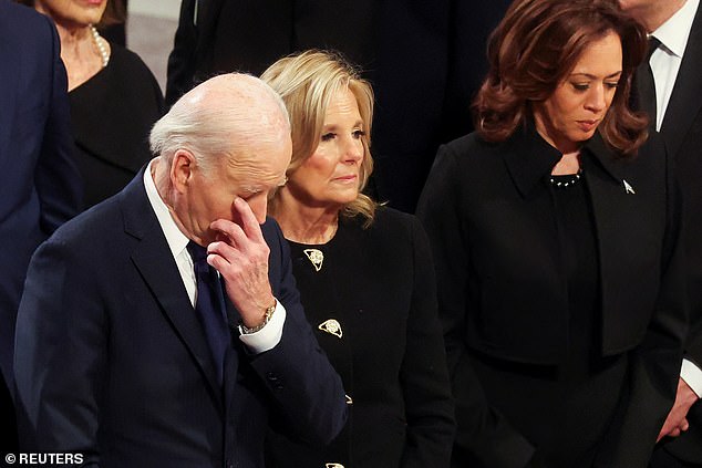 President Joe Biden (left) wipes a tear from his eye at President Jimmy Carter's funeral as first lady Jill Biden (center) and Vice President Kamala Harris (right) appear somber